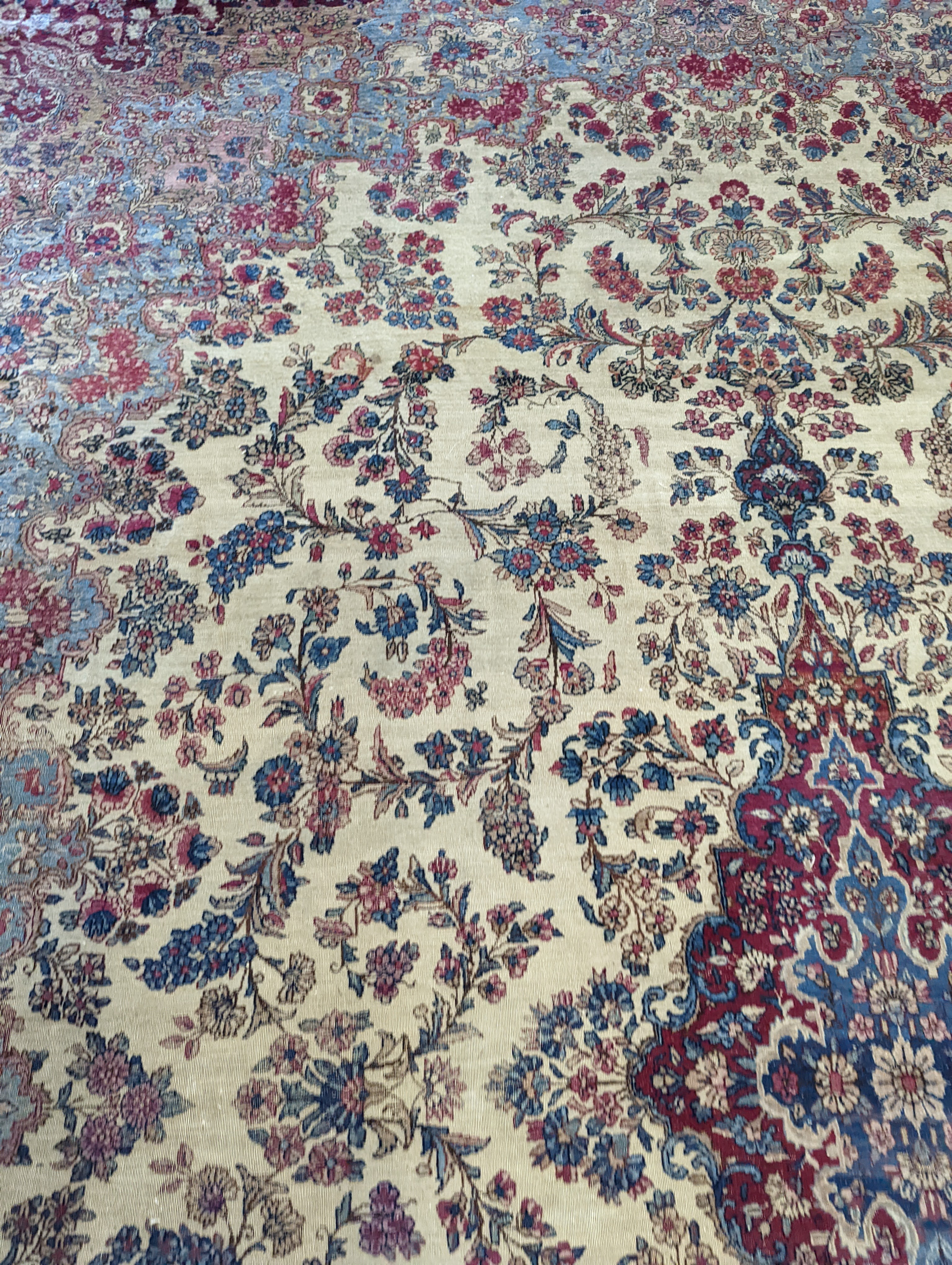 A North West Persian ivory ground carpet, 396 x 290cm